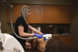 A provider performs coolsculpt, a double chin surgery alternative