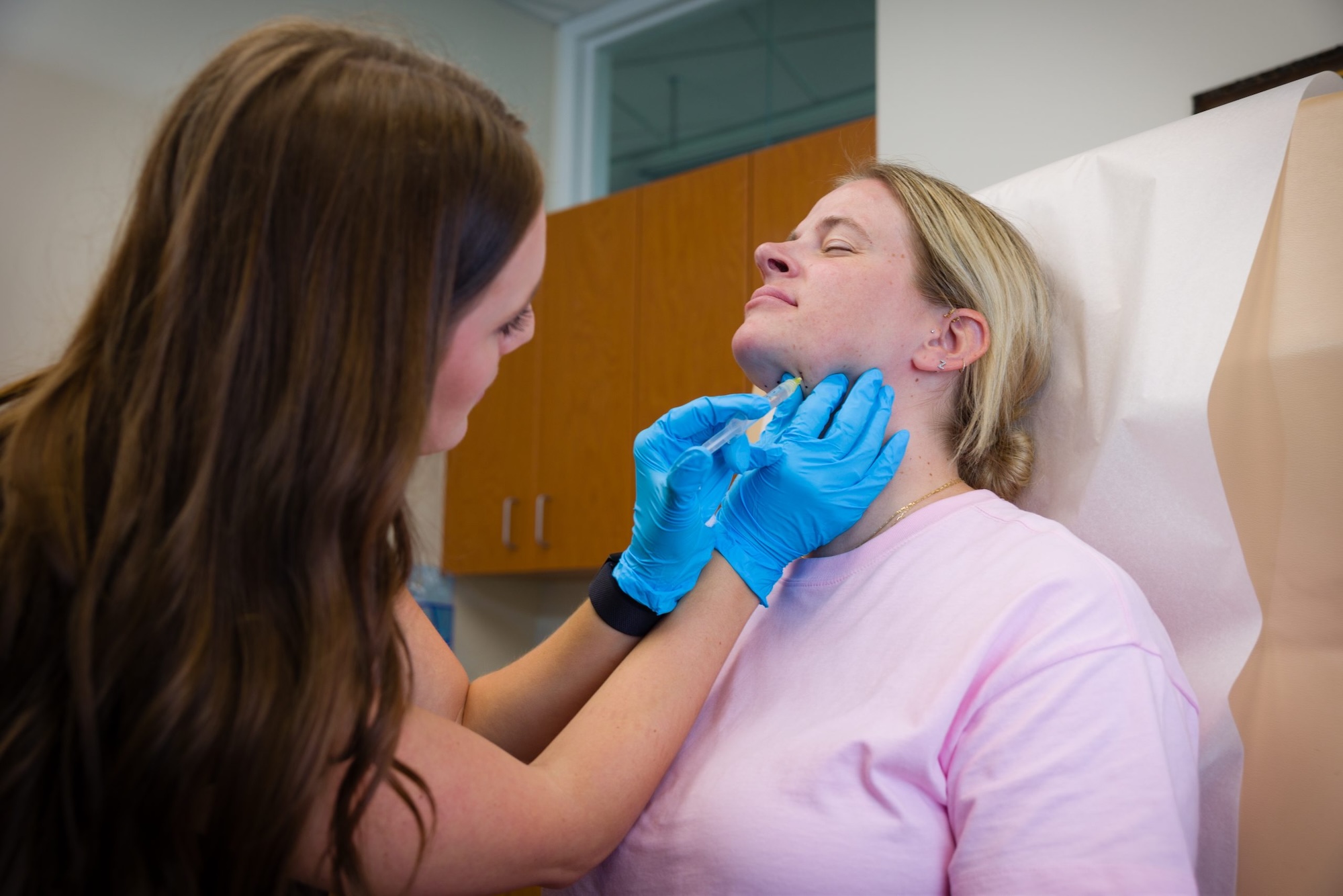 A Phases provider administers a patient's Kybella as part of her plan for neck contouring near Westfield.