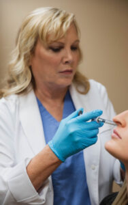 Dr. Turkle places a patient's filler injections, a complementary treatment often recommended by the best facelift surgeons in Indianapolis.