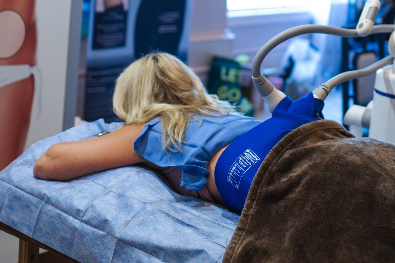 A provider prepares the patient's lower back for CoolSculpting near Westfield.