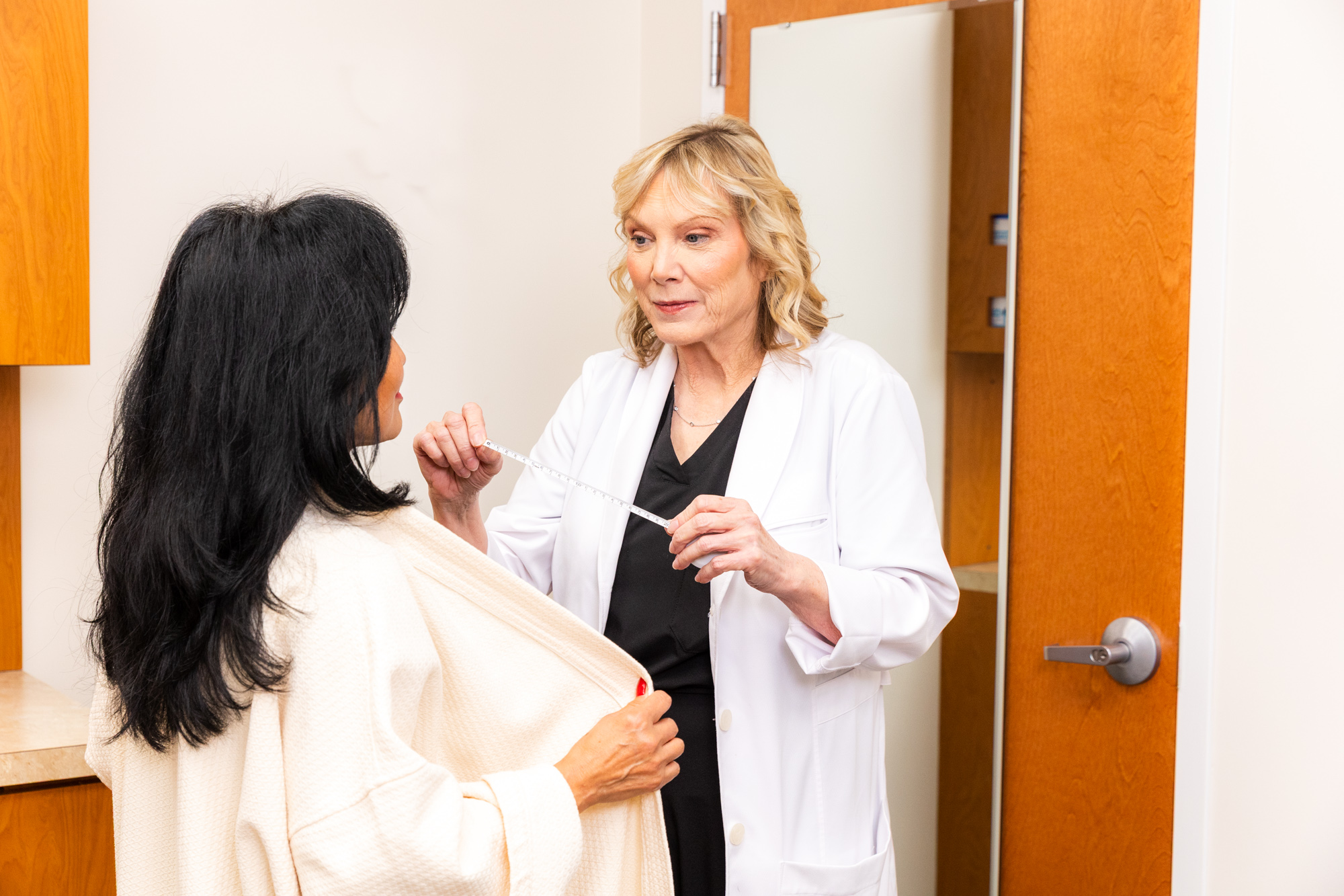 Dr. Turkle consults with a patient to plan her breast uplift in Indiana.