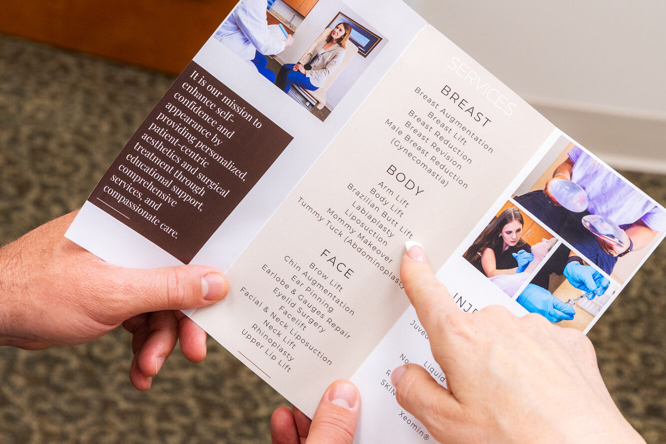 A provider shares a brochure to illustrate a patient's options for body contouring in Carmel.
